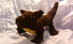 Crocheted pine marten, brown with yellow patch at throat