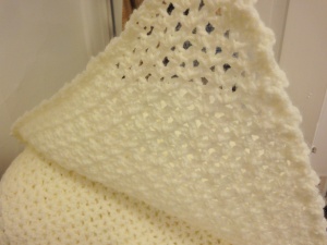 Off-white crocheted blanket