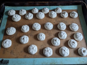Meringue cookies on a baking sheet